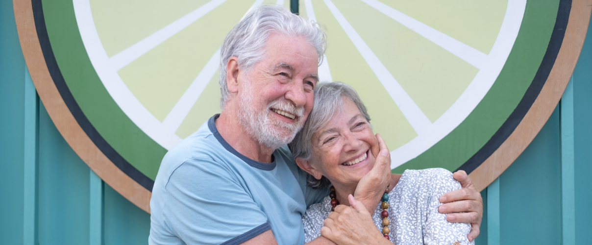 Smiling elderly couple, Diamond and her husband, celebrating credit repair success