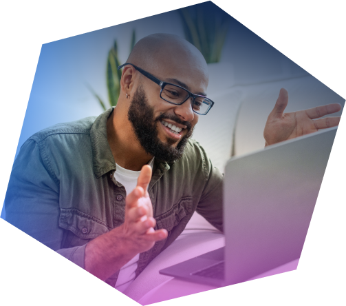 A man is attending a live meeting on his laptop.